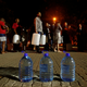 People queue to collect water as fears over the city's water crisis grow in Cape Town